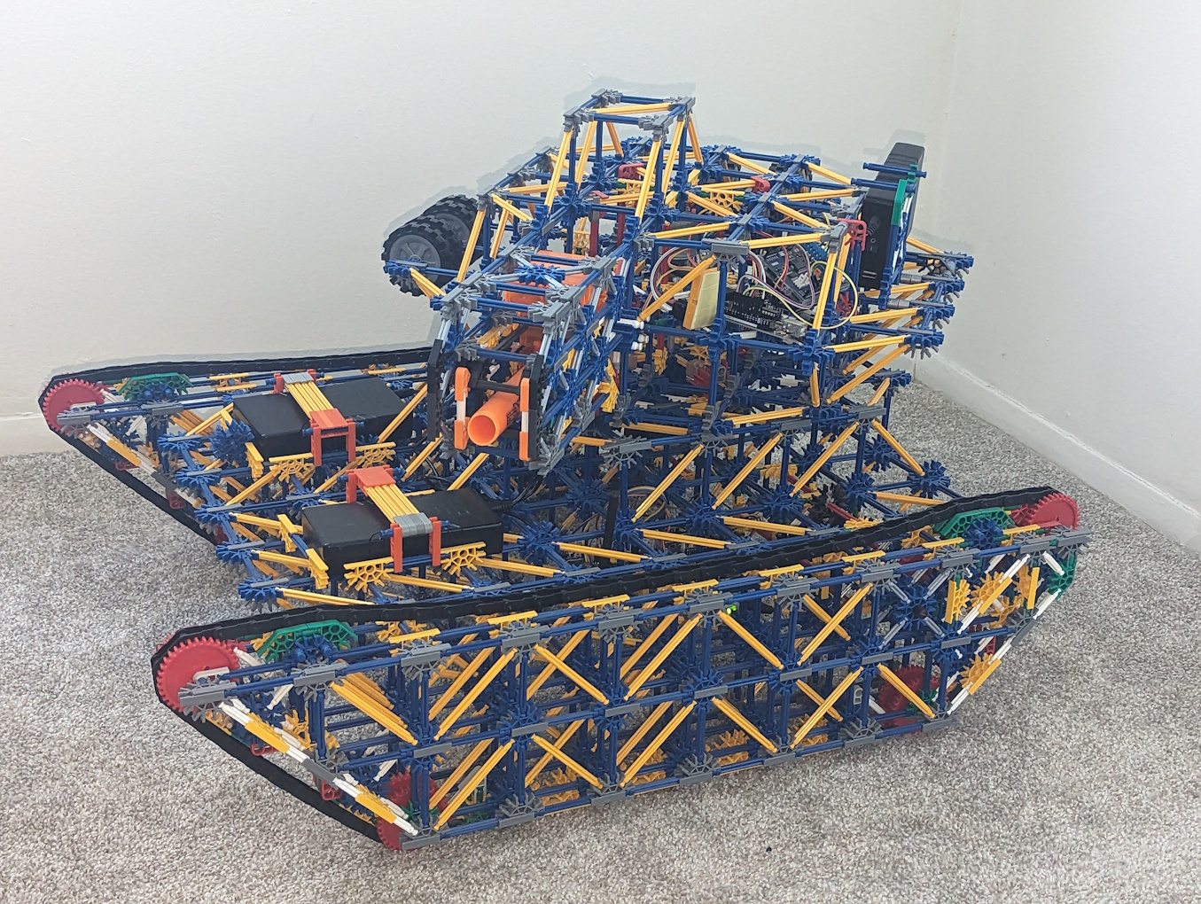 A K'nex tank with various electronic components integrated within